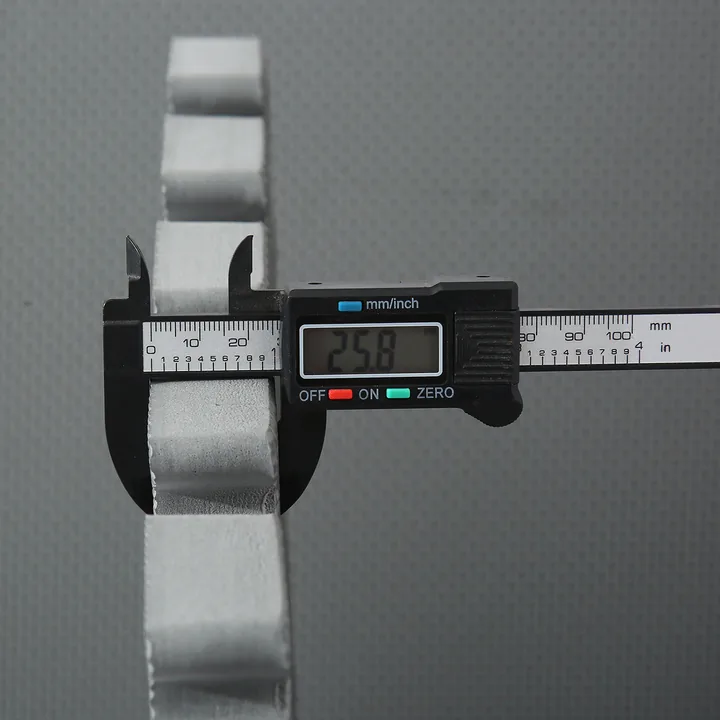 Measuring a cross-pattern EVA tile with a caliper